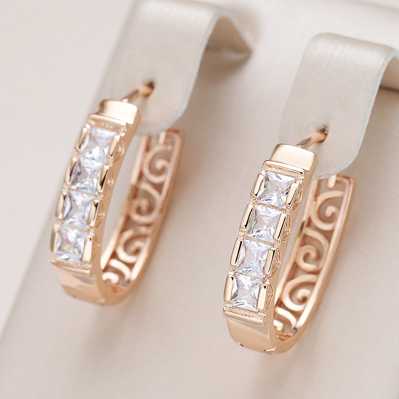 Elegante Roségold Creolen mit funkelnden Zirkonia und kunstvollem Design