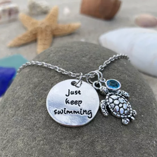 Motivierende Schildkrötenkette mit Spruch und blauem Zirkonia Anhänger