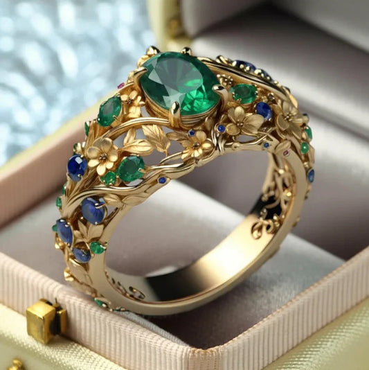 Luxuriöser Blumenring mit grünen und blauen Kristallen