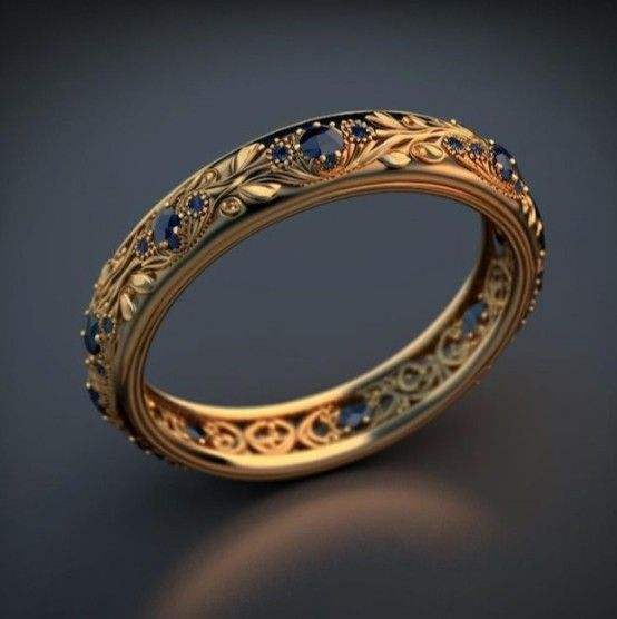 Botanischer Ewigkeitsring aus Gold mit blauem Zirkonia