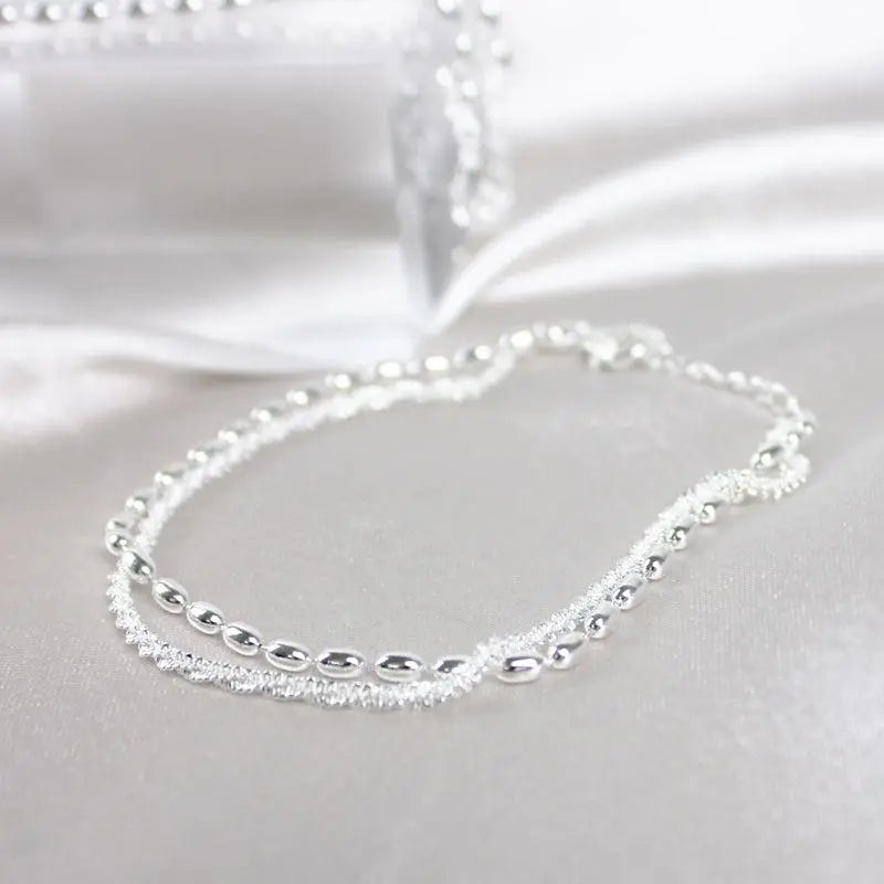 Glamouröses Zirkonia-Armband mit stilvoller Perlenkette
