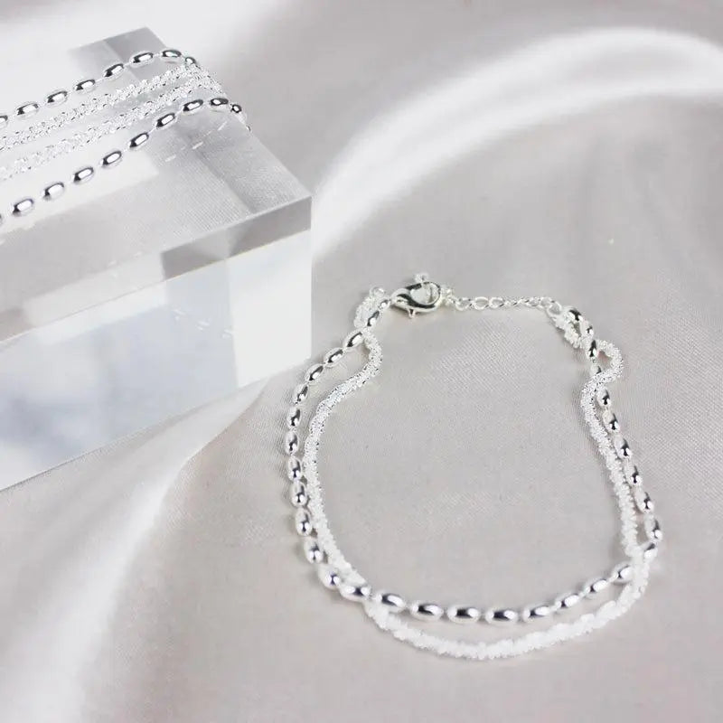 Glamouröses Zirkonia-Armband mit stilvoller Perlenkette