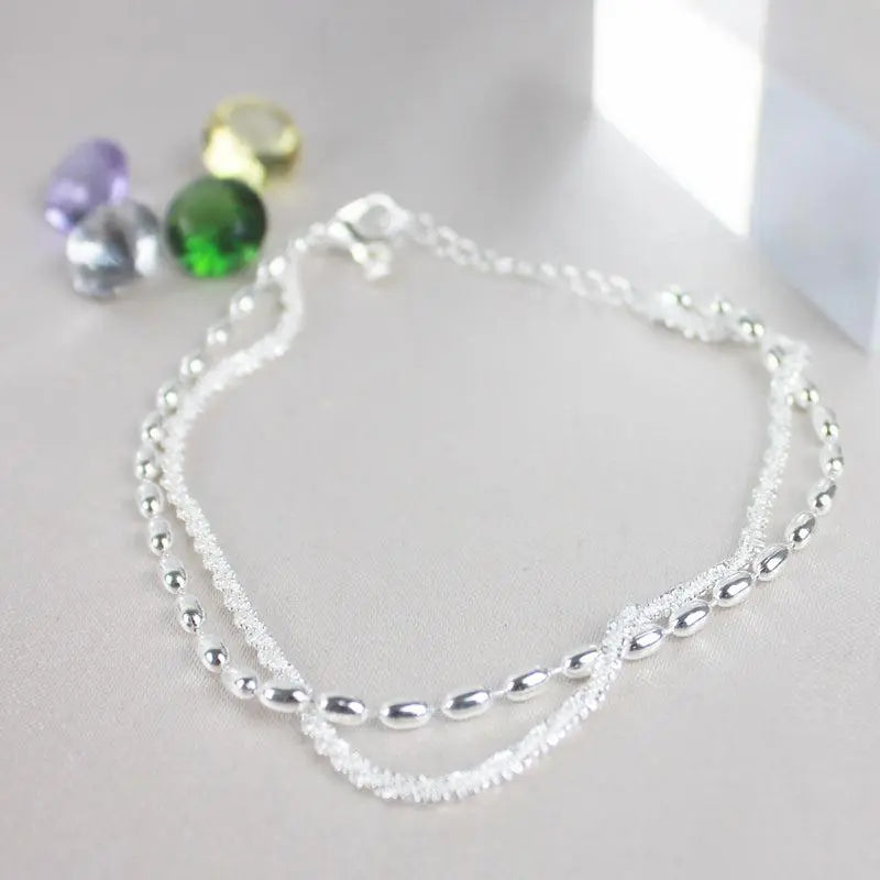 Glamouröses Zirkonia-Armband mit stilvoller Perlenkette
