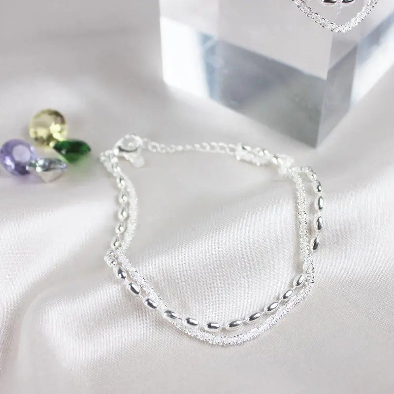Glamouröses Zirkonia-Armband mit stilvoller Perlenkette