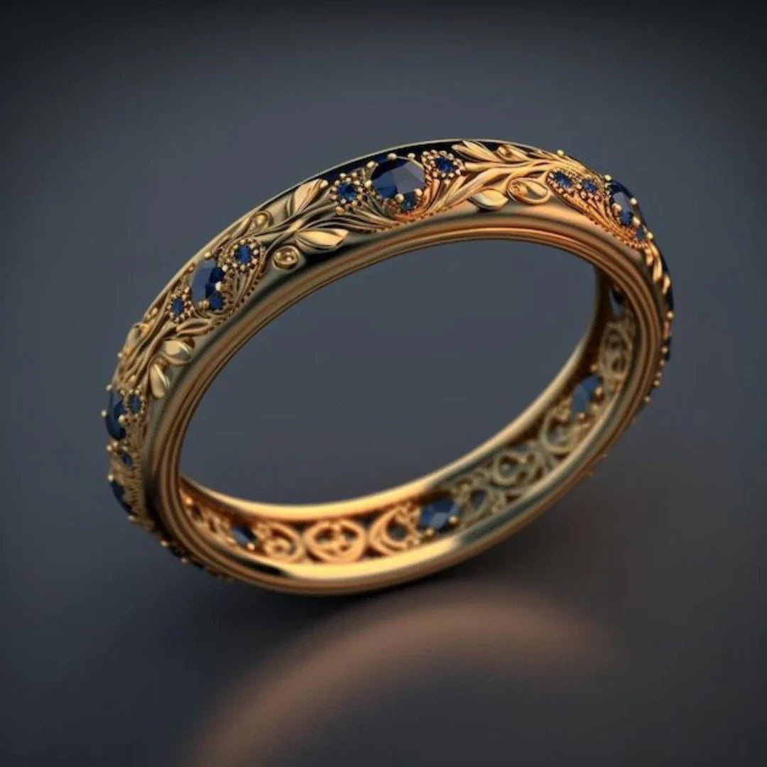 Botanischer Ewigkeitsring aus Gold mit blauem Zirkonia