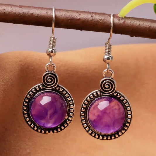 Vintage Ohrringe mit lila Kristall und Spiral-Details