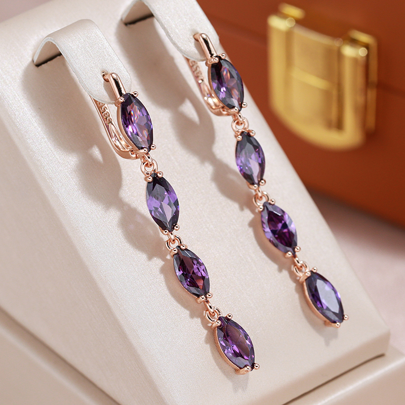 Elegante Ohrringe mit violetten Zirkon-Steinen in Tropfenform