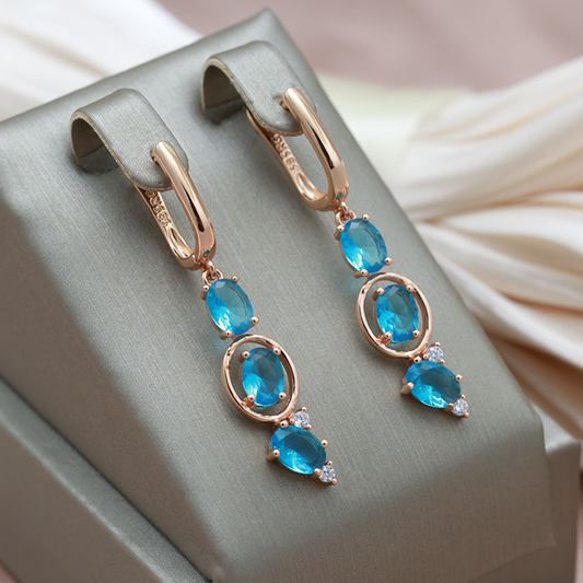 Elegante Ohrhänger mit blauen Zirkon-Steinen im Rosé-Look
