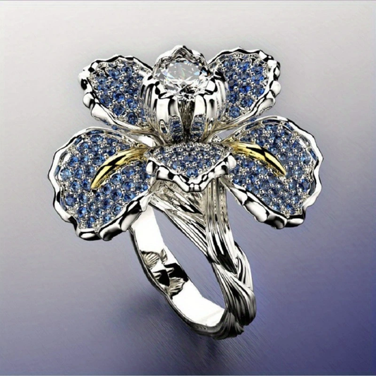 Silberring mit blauer Blume und Kristall