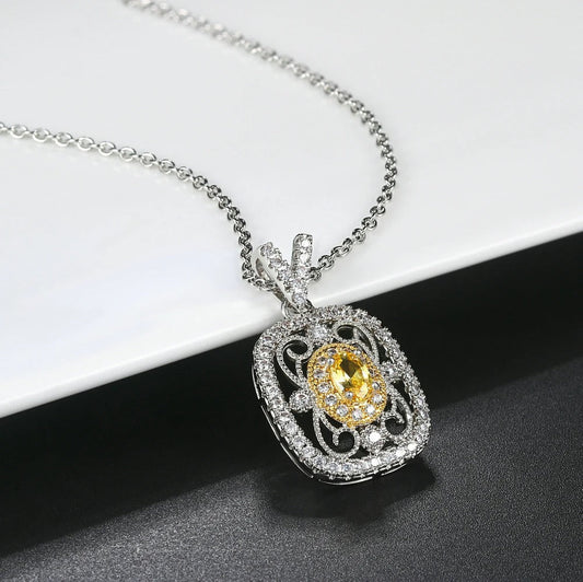 Eleganter Anhänger mit gelbem Edelstein und funkelnden Zirkonia Kristallen